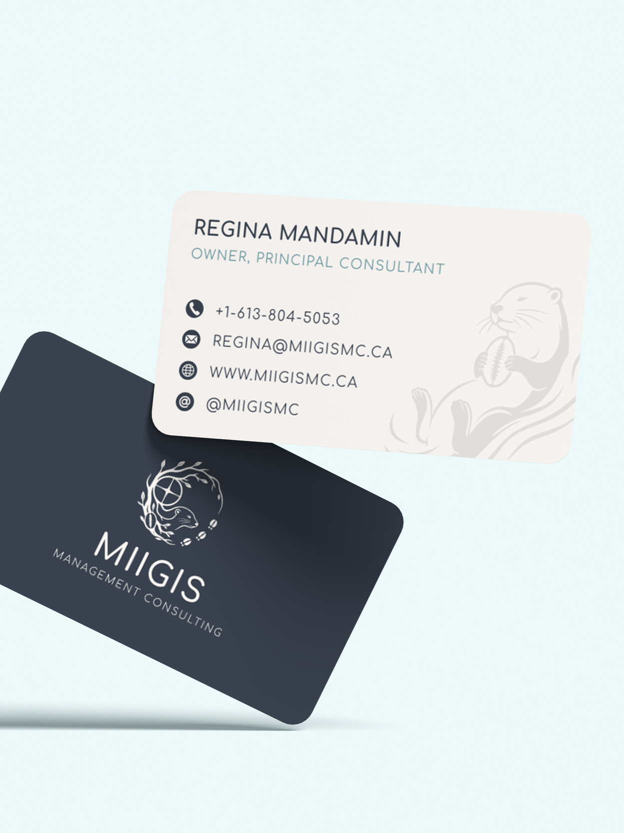 Business cards for Miigis Management Consulting and Regina Mandamin, featuring contact information and Miigis Management Consulting Logo.