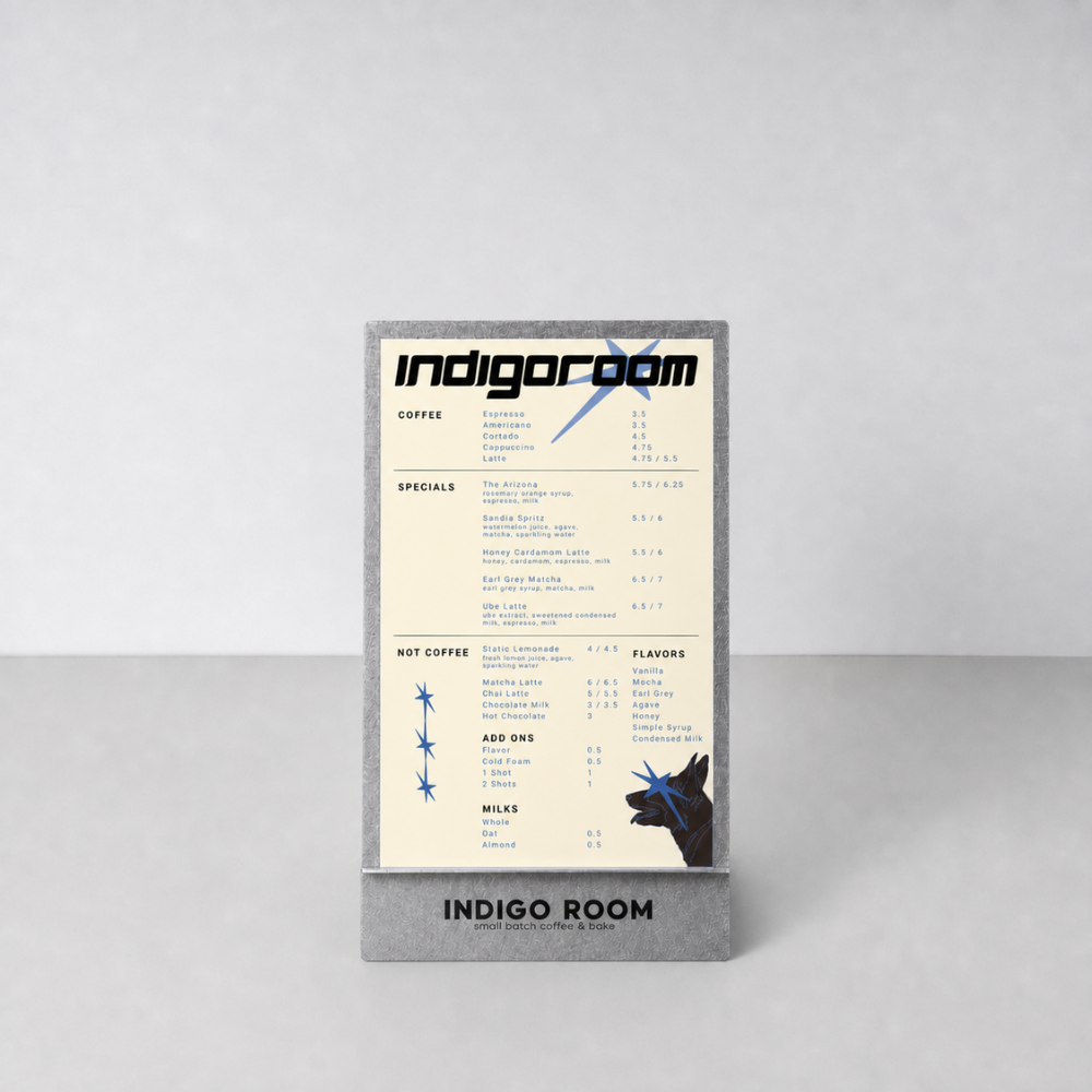 Coffee shop menu called Indigo Room featuring various coffee, specialty drinks, flavors, add-ons, and milk options, with a gray frame and minimalist design.