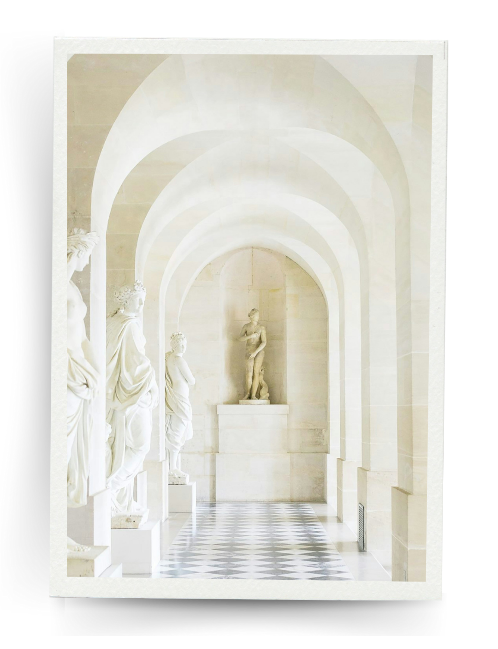 Interior of a museum or gallery with marble statues and arched ceiling.