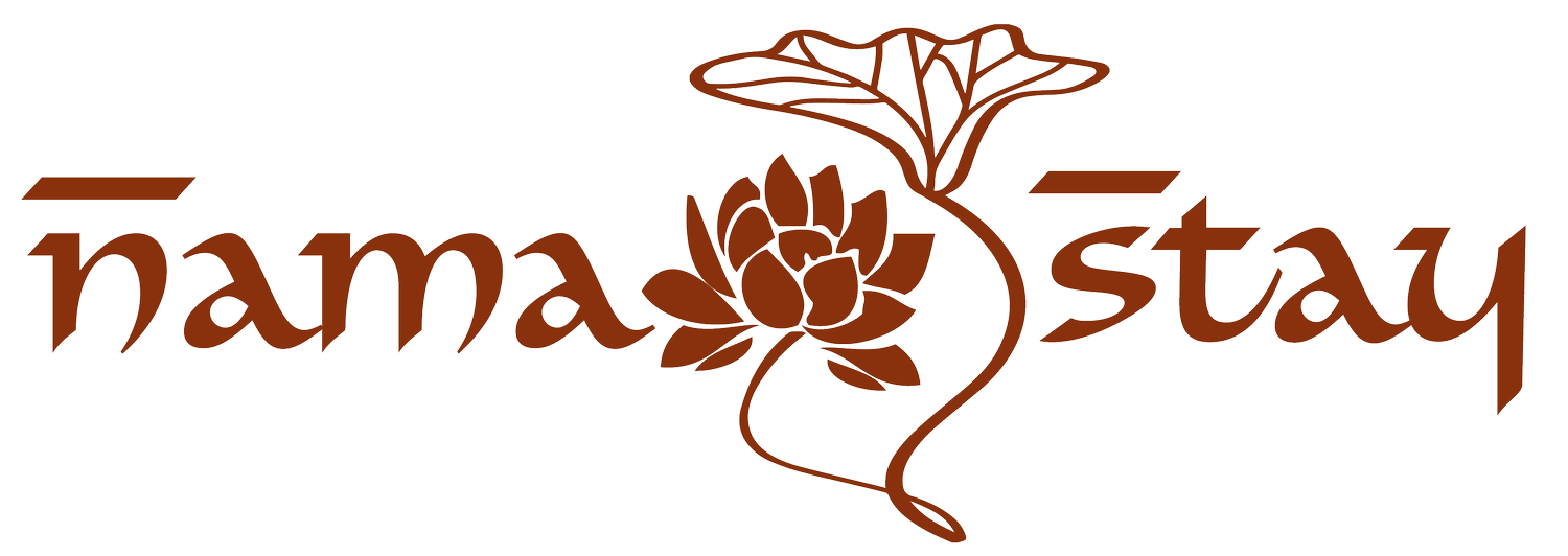 An illustration of a flower with the words 'namaste stay' in brown text, with a stylized flower and leaf design connecting the words.