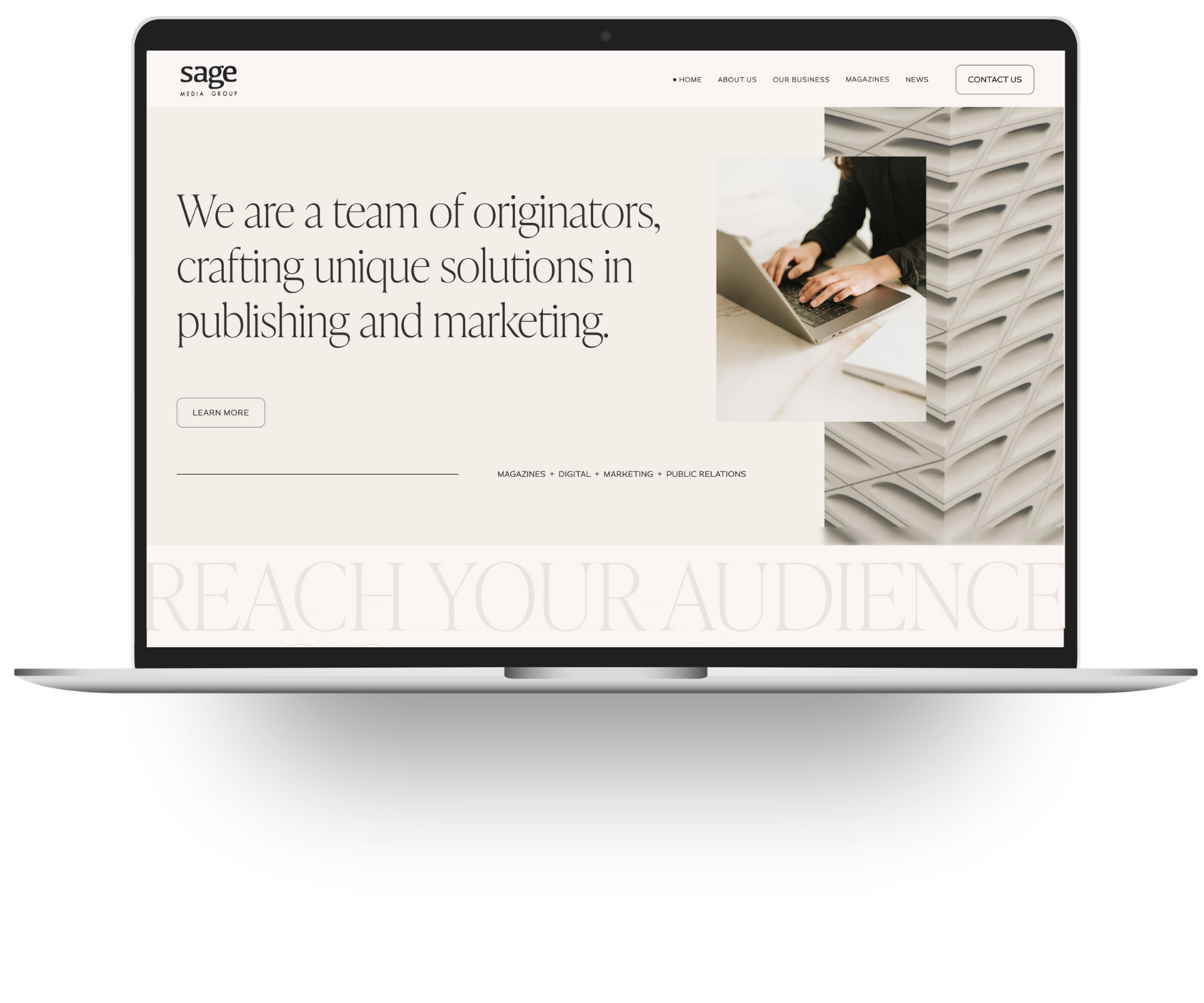 Screenshot of a website homepage for Sage Media Group with a headline about crafting solutions in publishing and marketing, a 'Learn More' button, and an image of a person typing on a laptop.