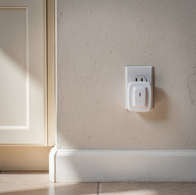 plastic plug covers inserted into living room wall outlet