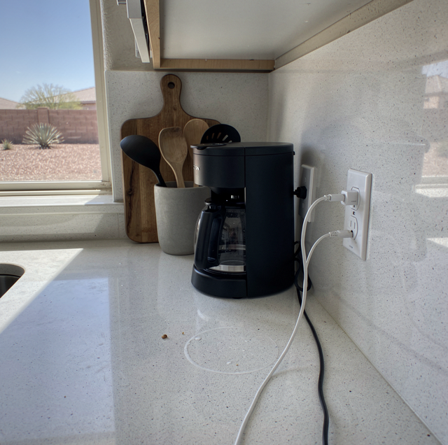 Scorched electrical wall outlet with melted plug