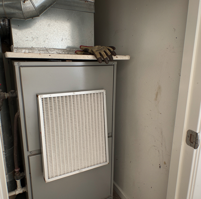 dirty HVAC air filter ready for summer replacement