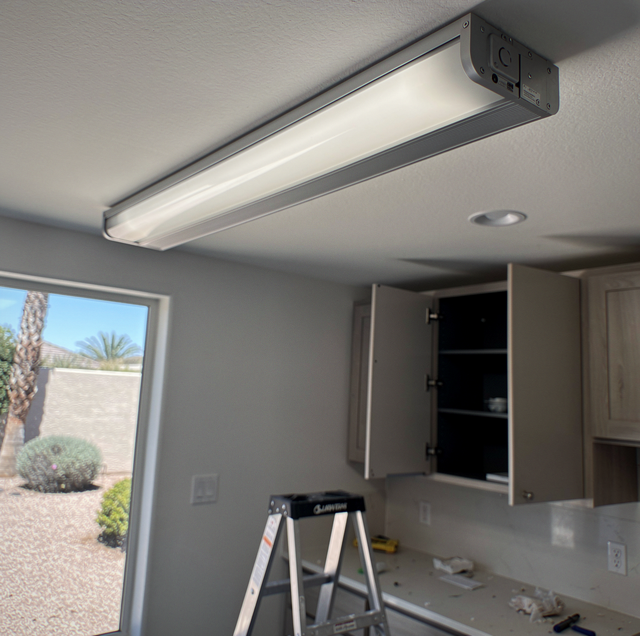fluorescent tube ballast wired inside light fixture