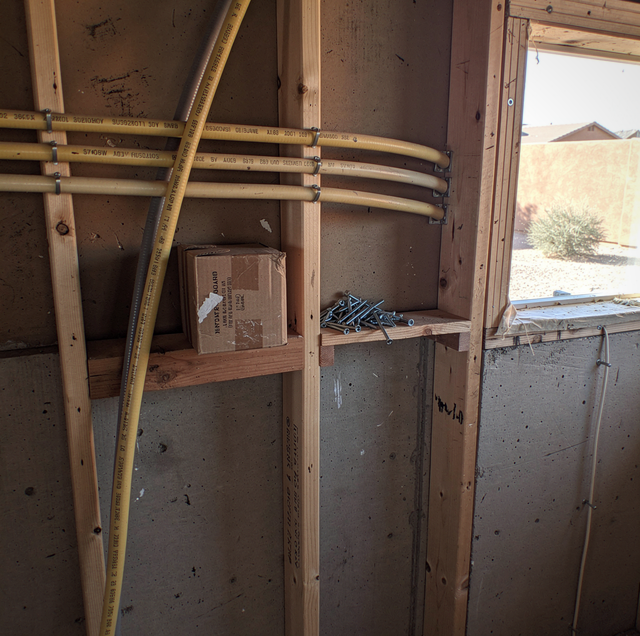 old two slot electrical outlet in dim bedroom