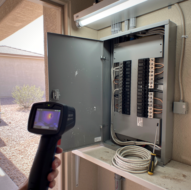 Thermal camera revealing hot lug inside electrical panel