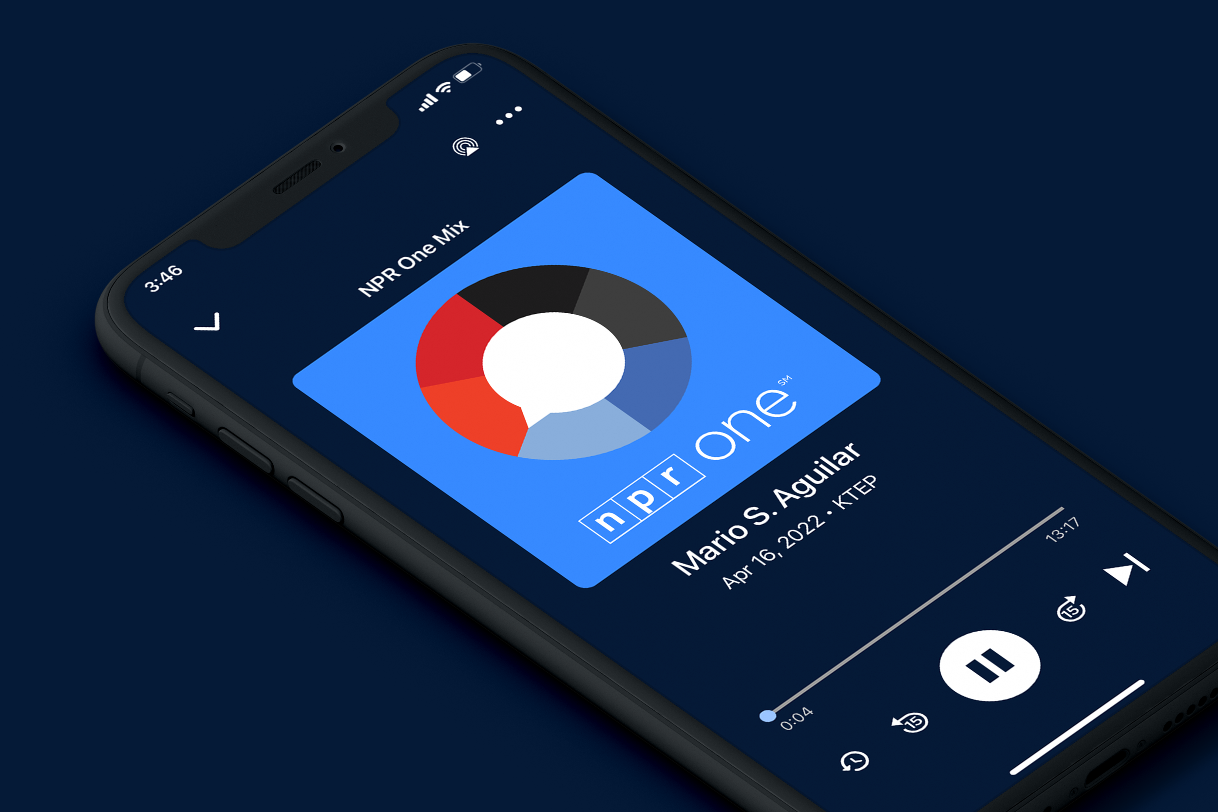 Close-up view of a smartphone screen displaying a music player app with the song "Mario S. Aguilar NPR One Mix" playing. The app shows a colorful circular visualizer, playback controls, and track details. The time is 3:46, and the phone has Wi-Fi, cellular, and battery icons visible at the top.