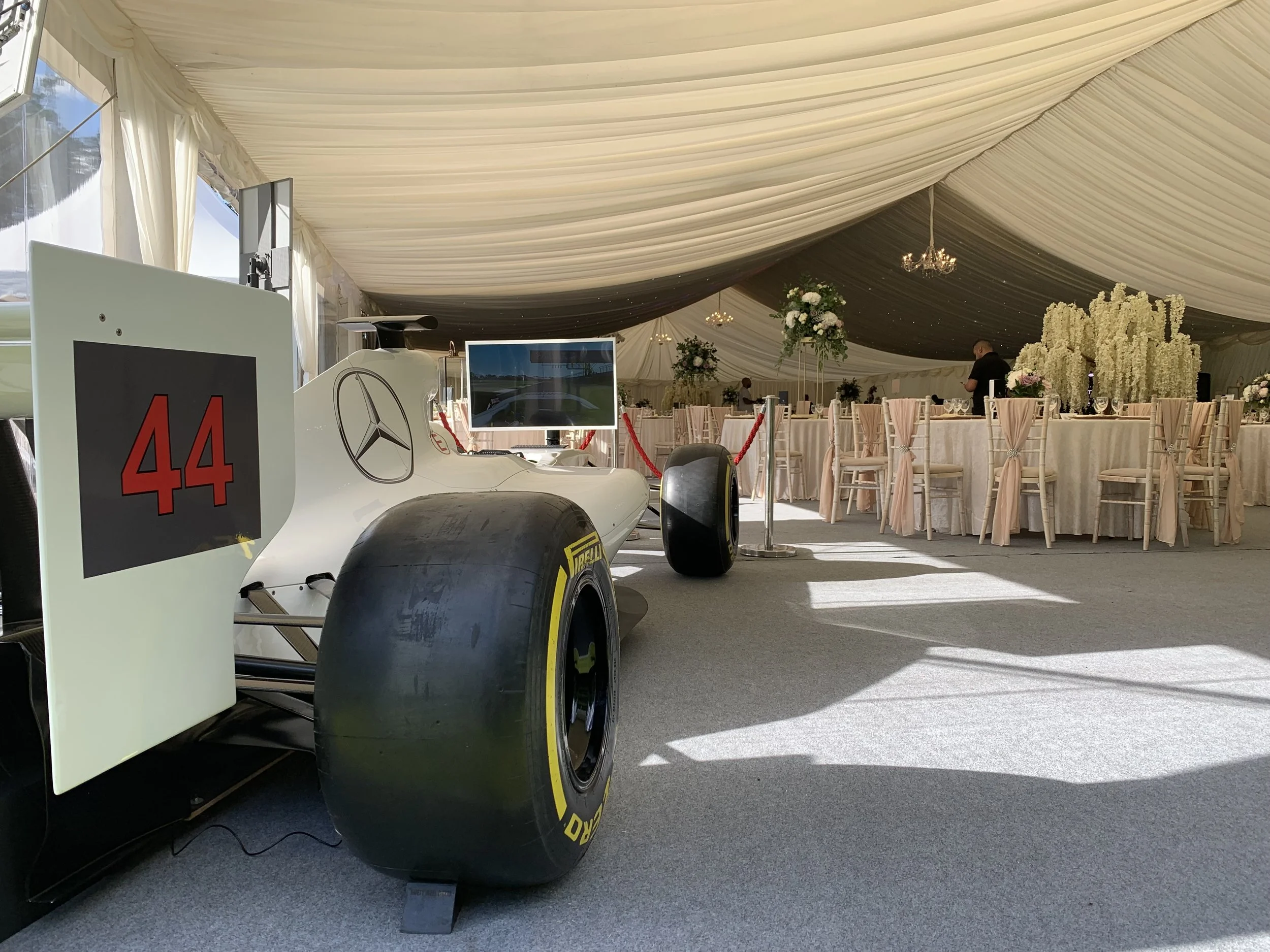 A Formula Party simulator at a wedding, with bespoke branding from our Qualifying Package.