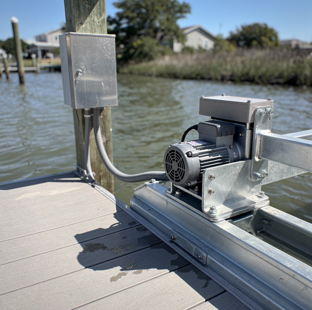 boat lift wiring on wooden dock at waterfront marina