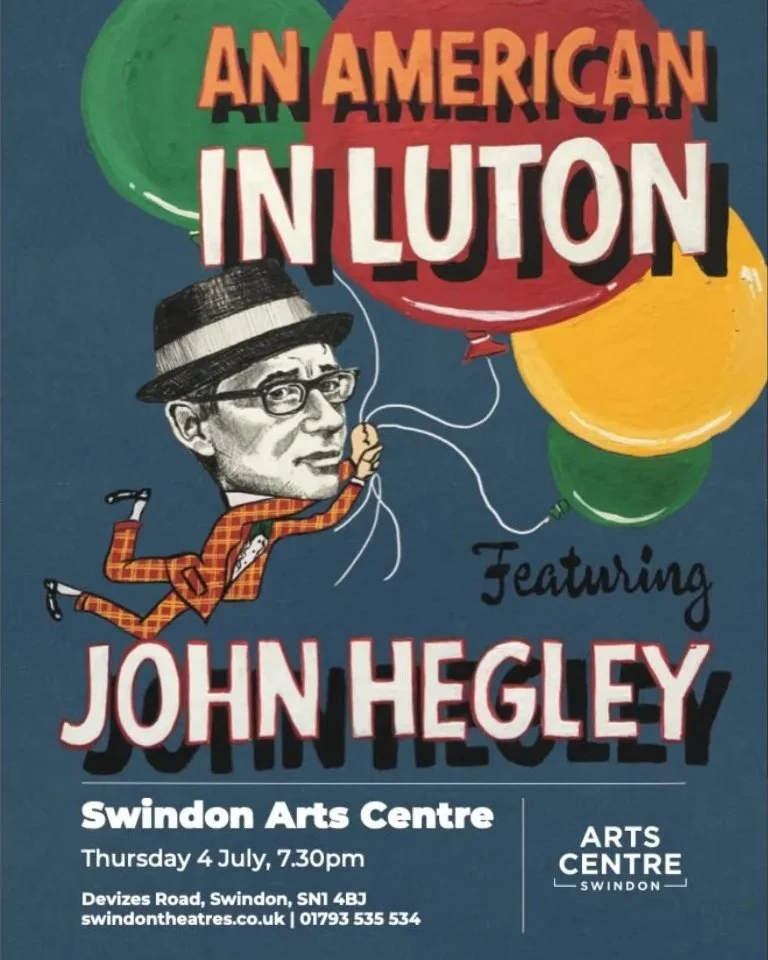 Poster advertising an event called "An American In Luton" featuring John Hegley at Swindon Arts Centre on Thursday, July 4th at 7:30 pm. The poster includes colorful balloons, a caricature of a man with glasses and a hat, wearing a checkered suit and jumping.