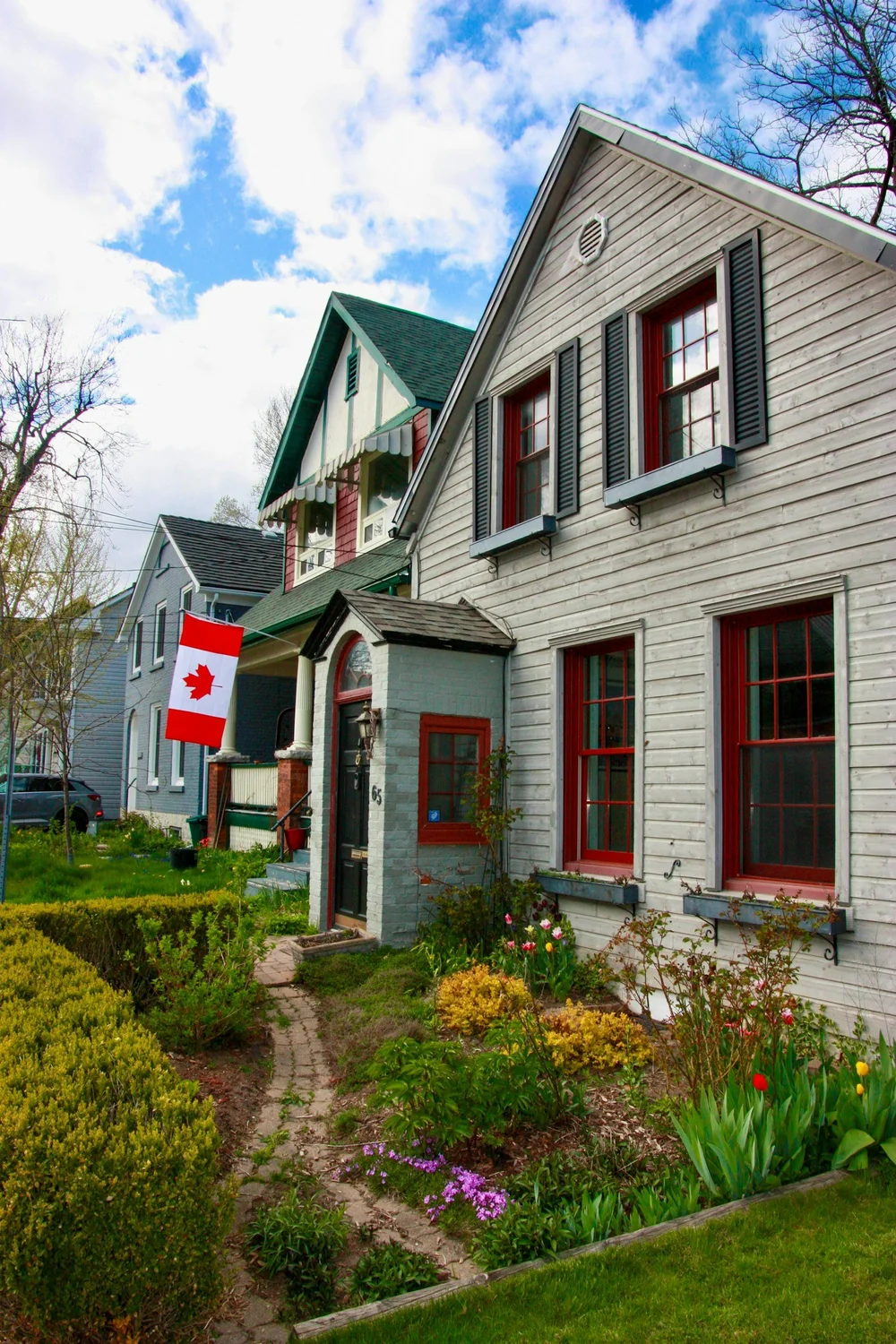 Houses with a Canadian flag on a residential street