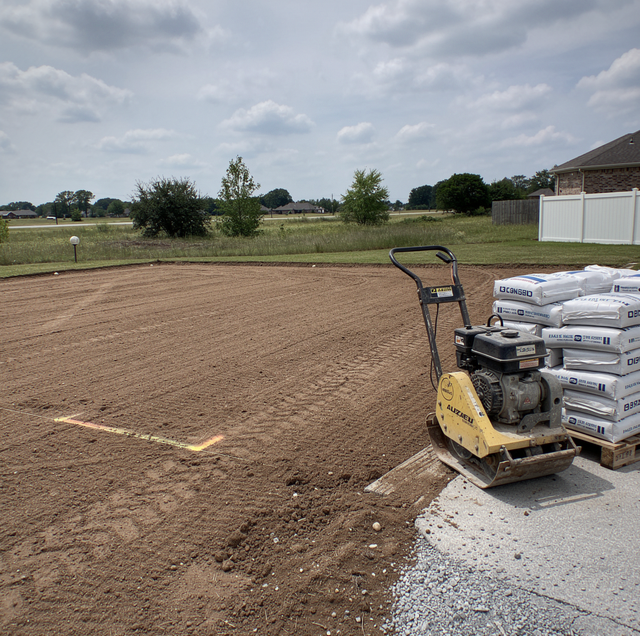 What a Properly Compacted Base Does Under a Driveway Slab