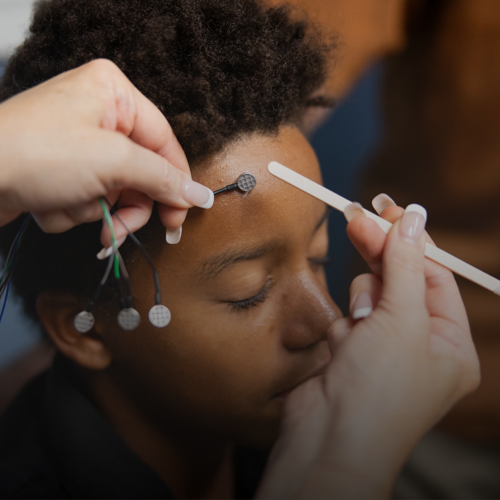 A kid getting the microcurrent neurofeedback service