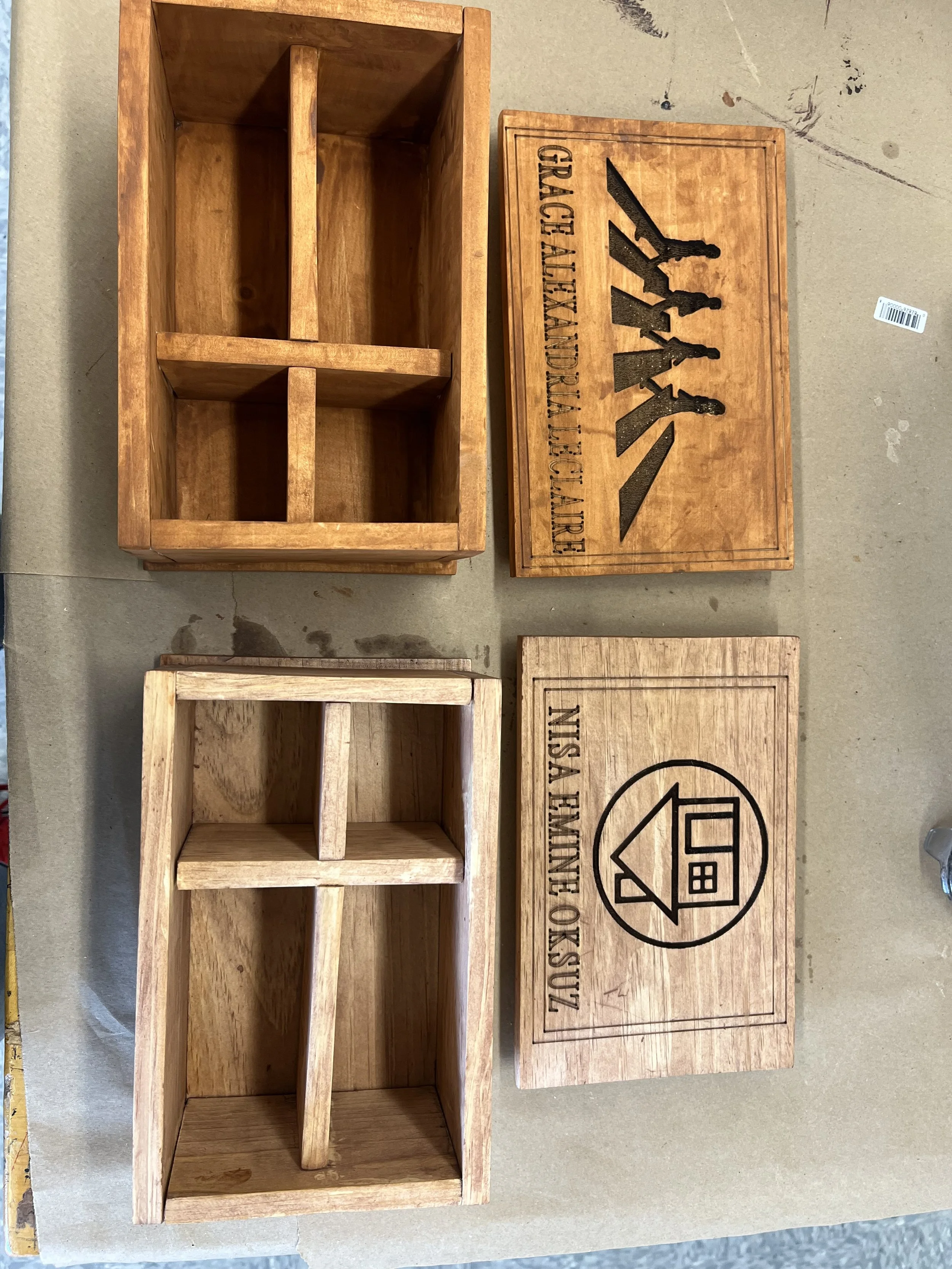 A wooden spice rack next to a wooden box with the word 'WALK' and an image of a family walking, and a round logo with a house inside.