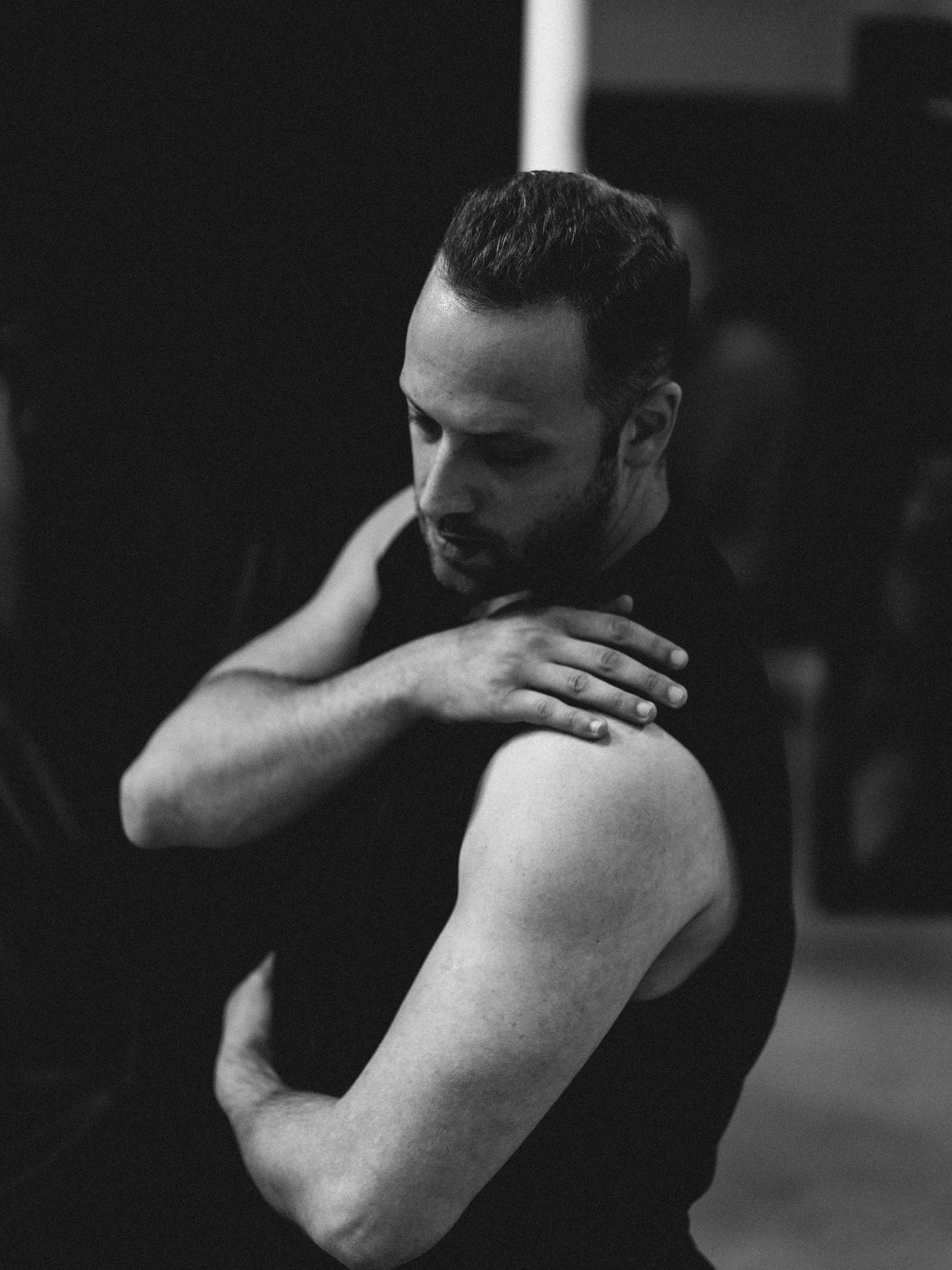 Portrait of movement coach Razvan Stoian during a contemporary dance rehearsal.