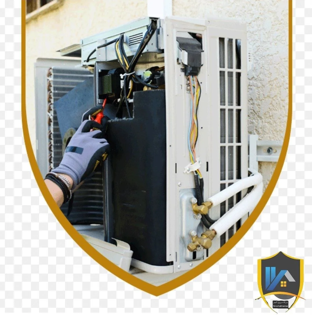 Technician repairing a wall-mounted air conditioning unit outdoors.