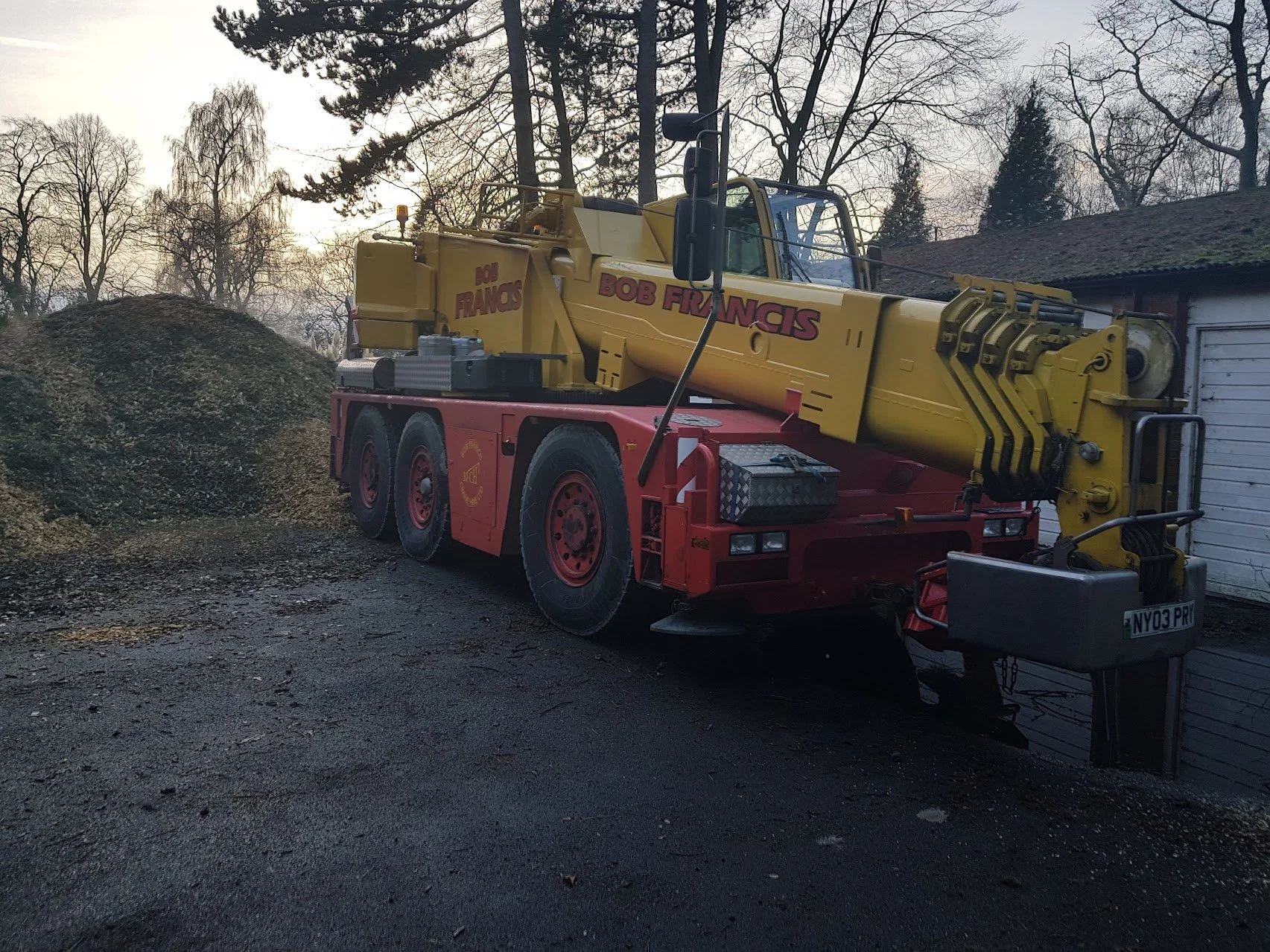 Specialist crane truck preparing for arborist tree felling in northe wales