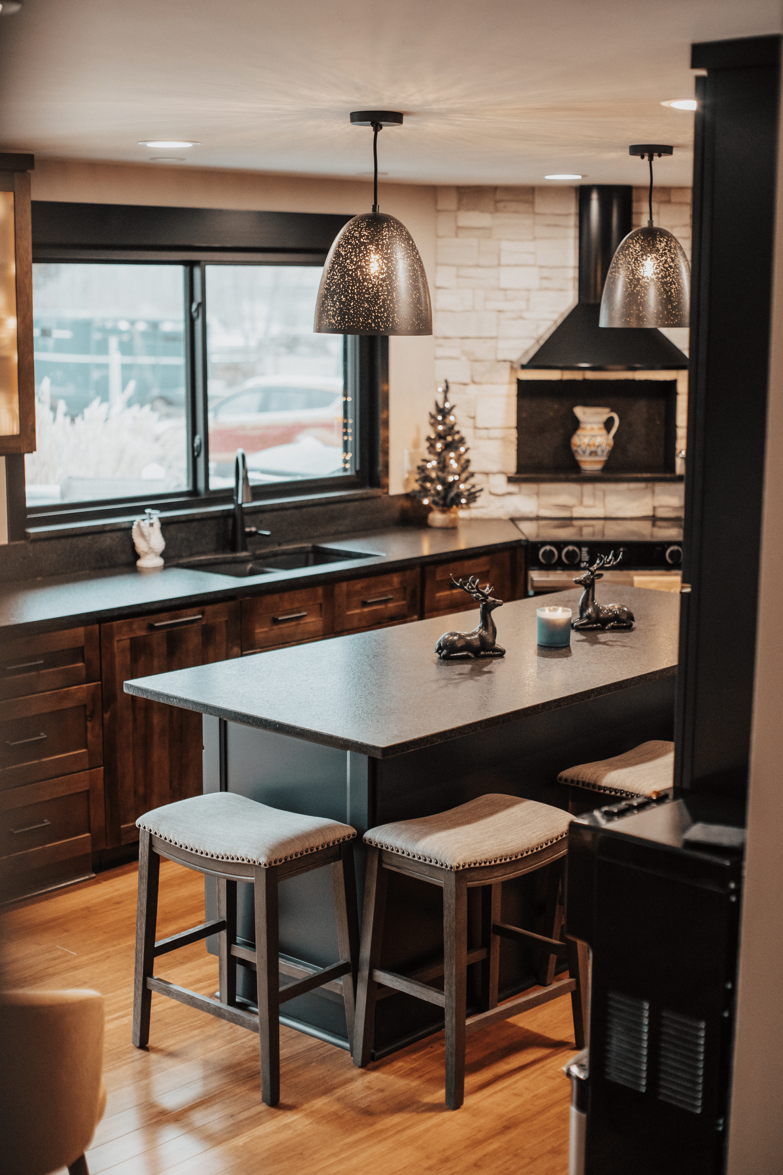 modern kitchen that is Christmas themed and has multiple decorations