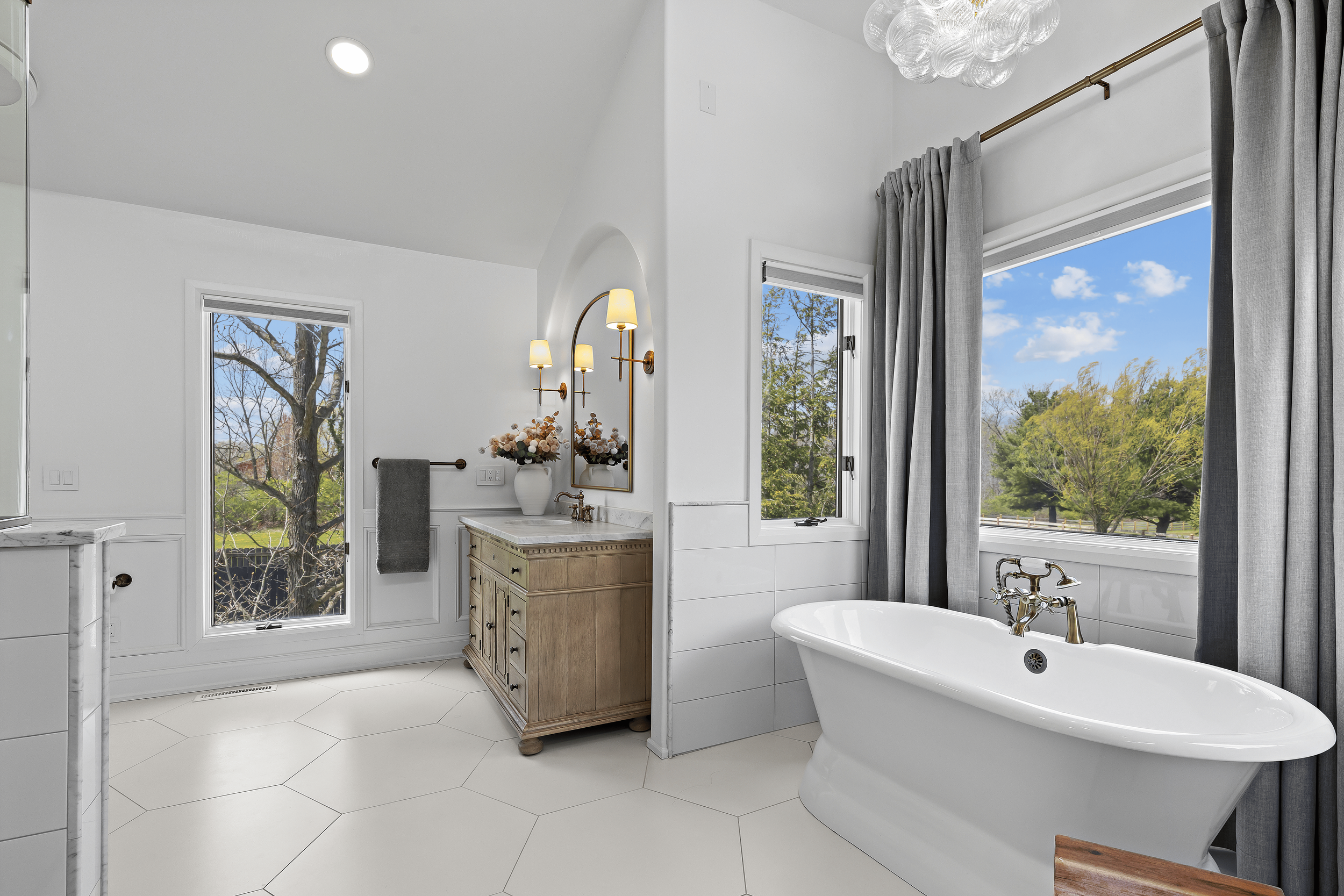 white modern bathroom with hexagon shaped white tile