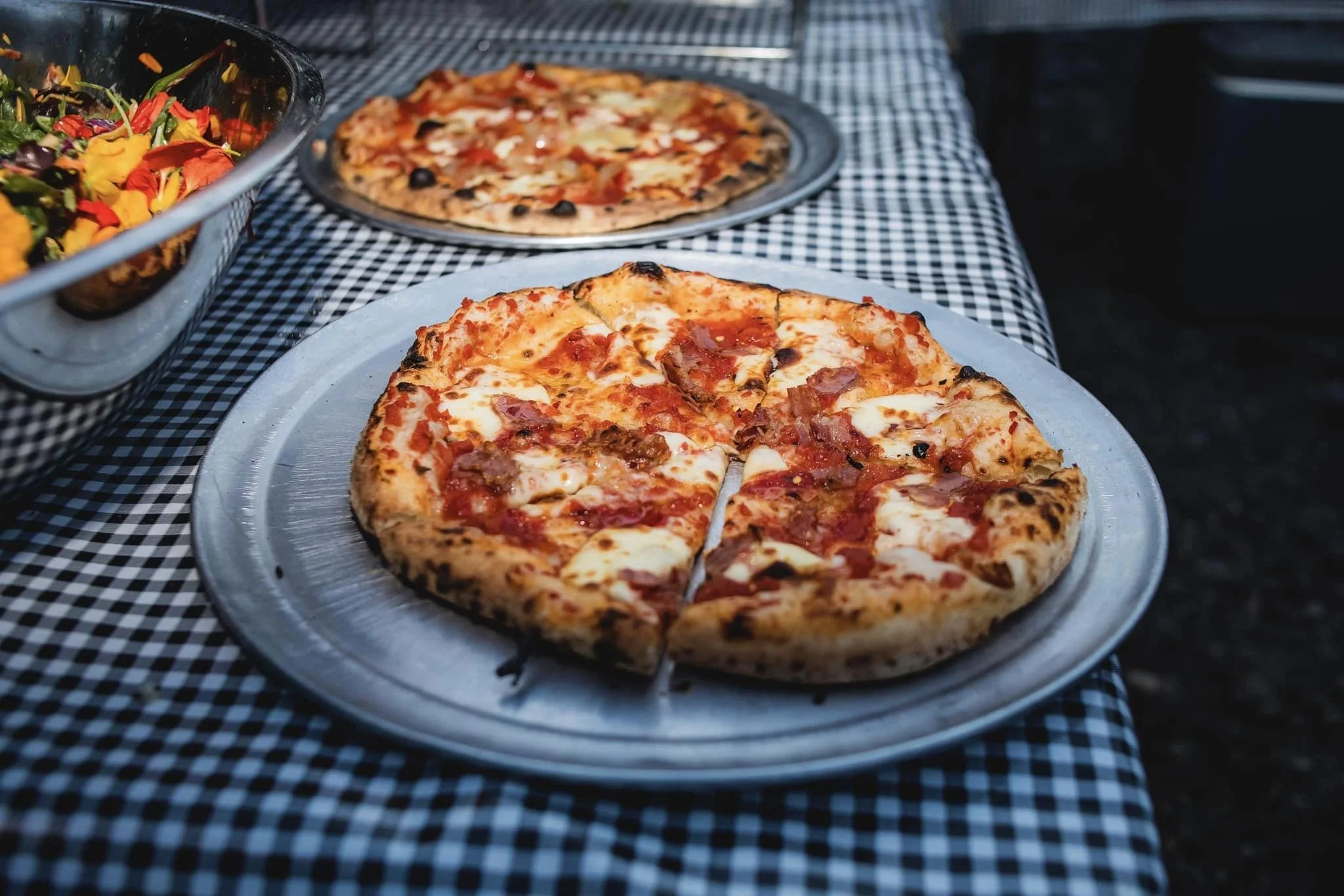 Wood fired pizzas fresh from our mobile wood fired pizza oven, rustic italian sourdough pizzas, south florida event catering