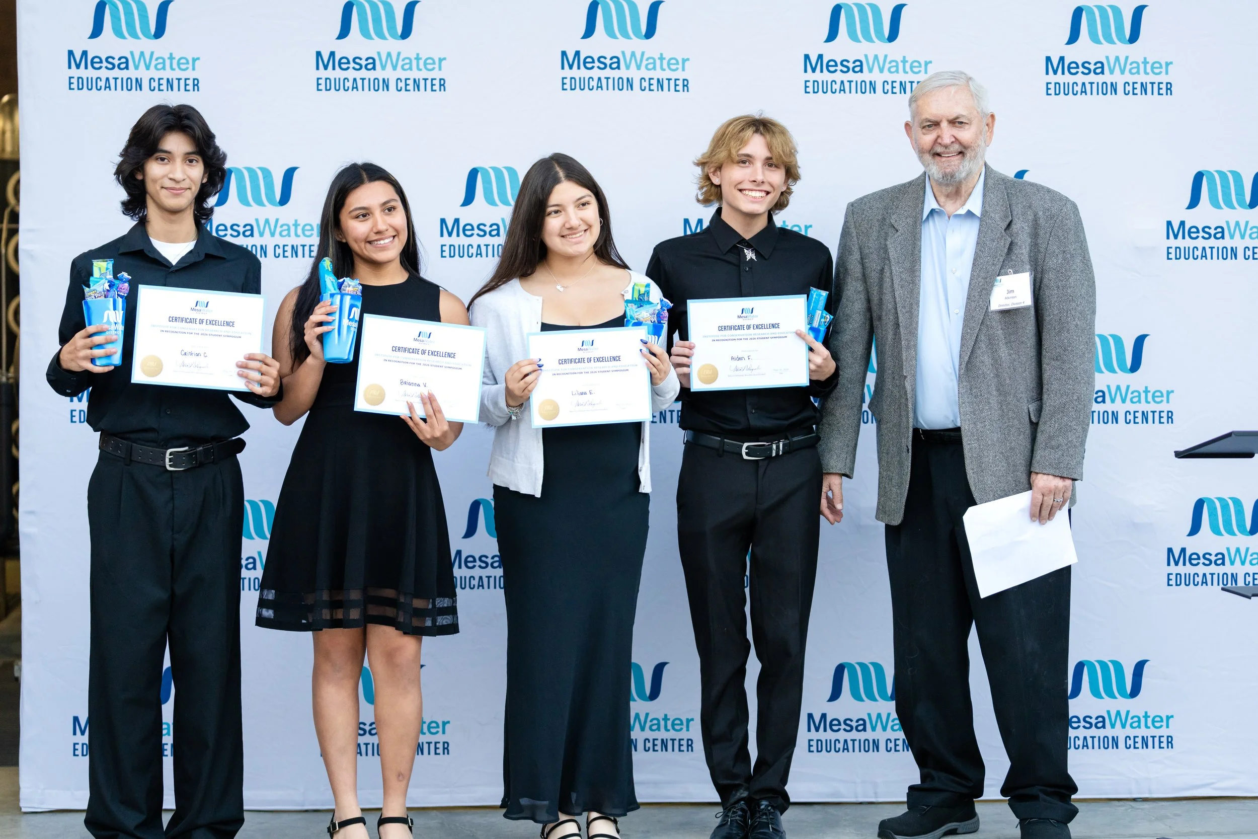 students posing with certificates for their second place standing for the poster presentation