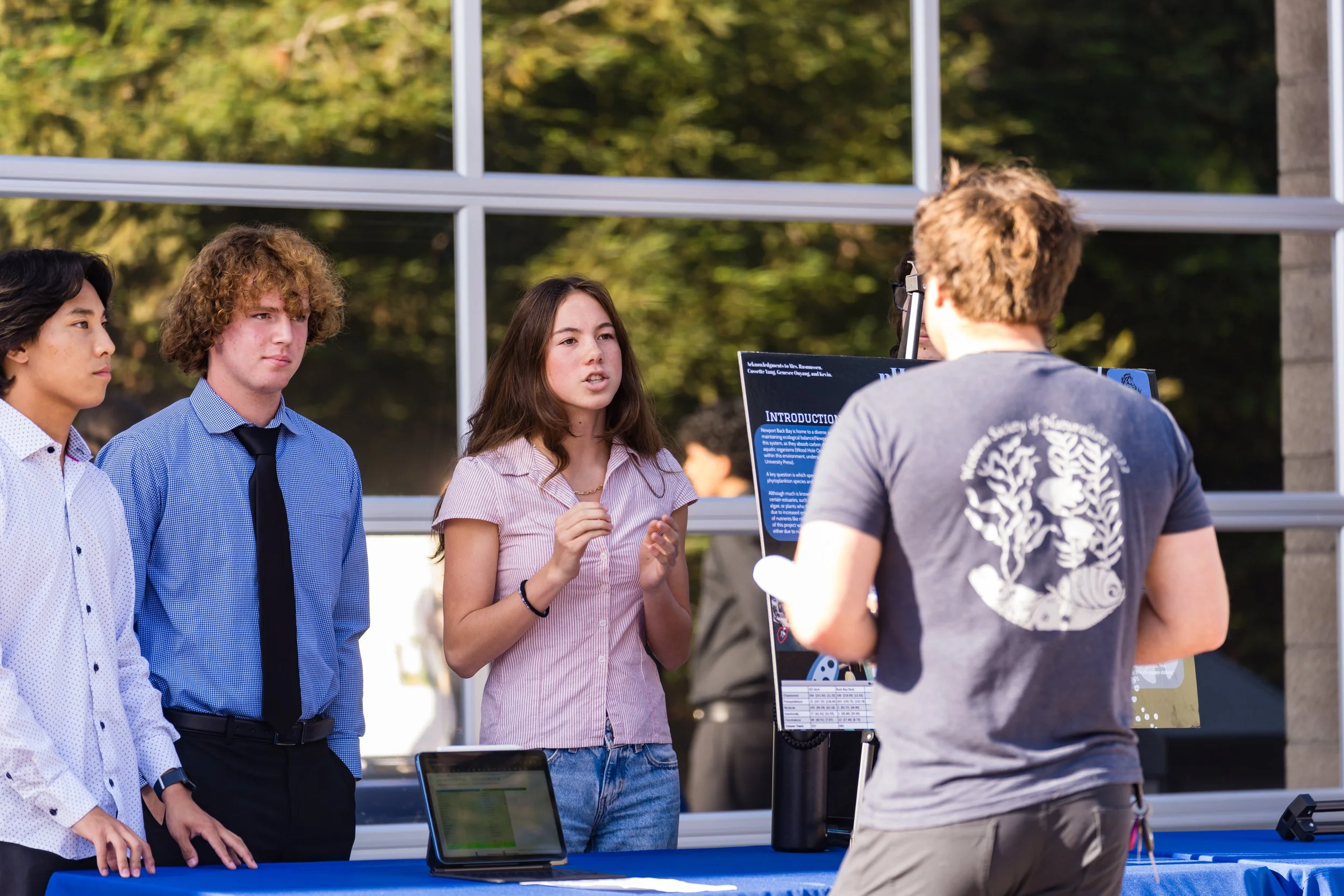 image of students presenting their posters at the poster presentation event