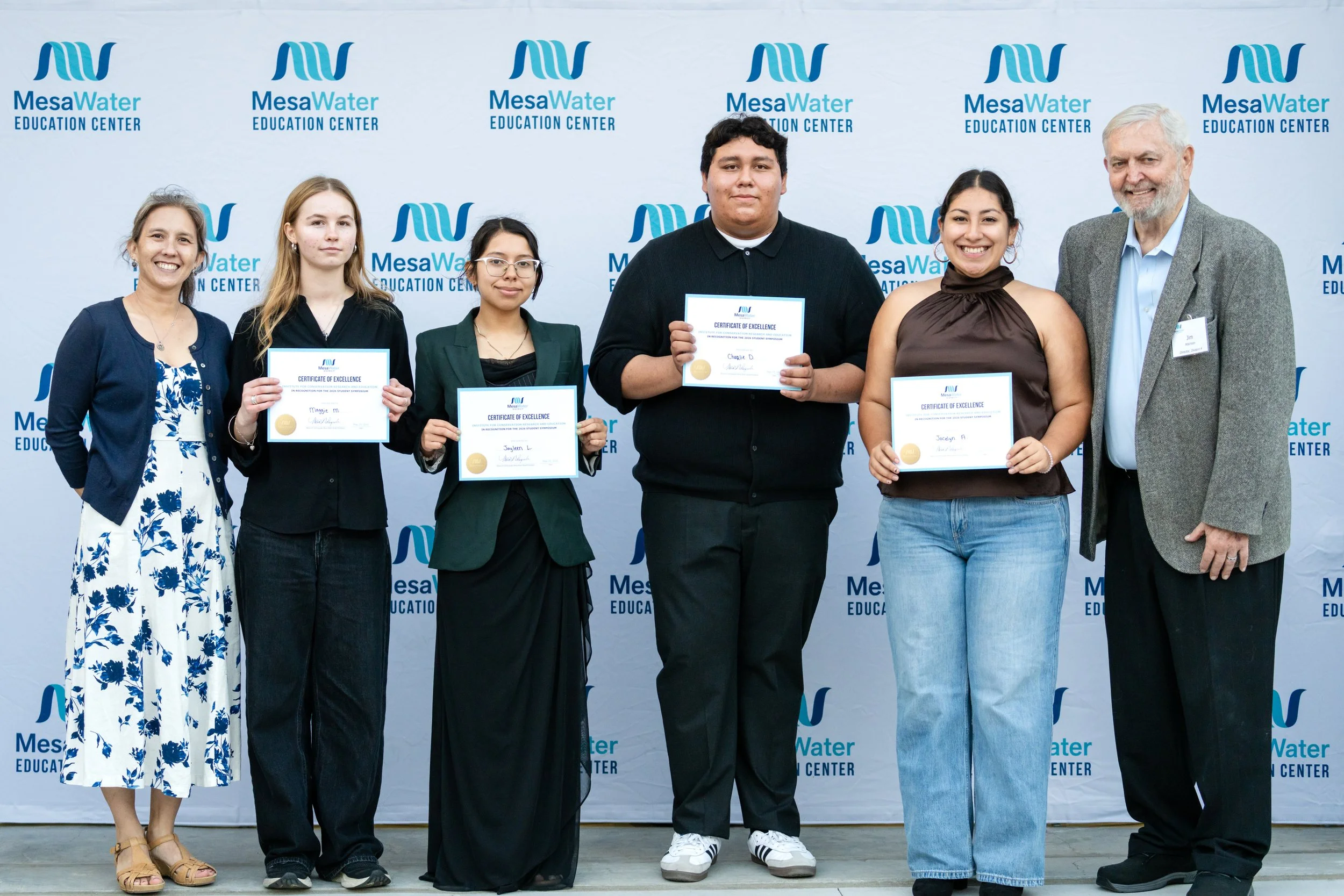 image of students posing with first place certificates for the poster presentation