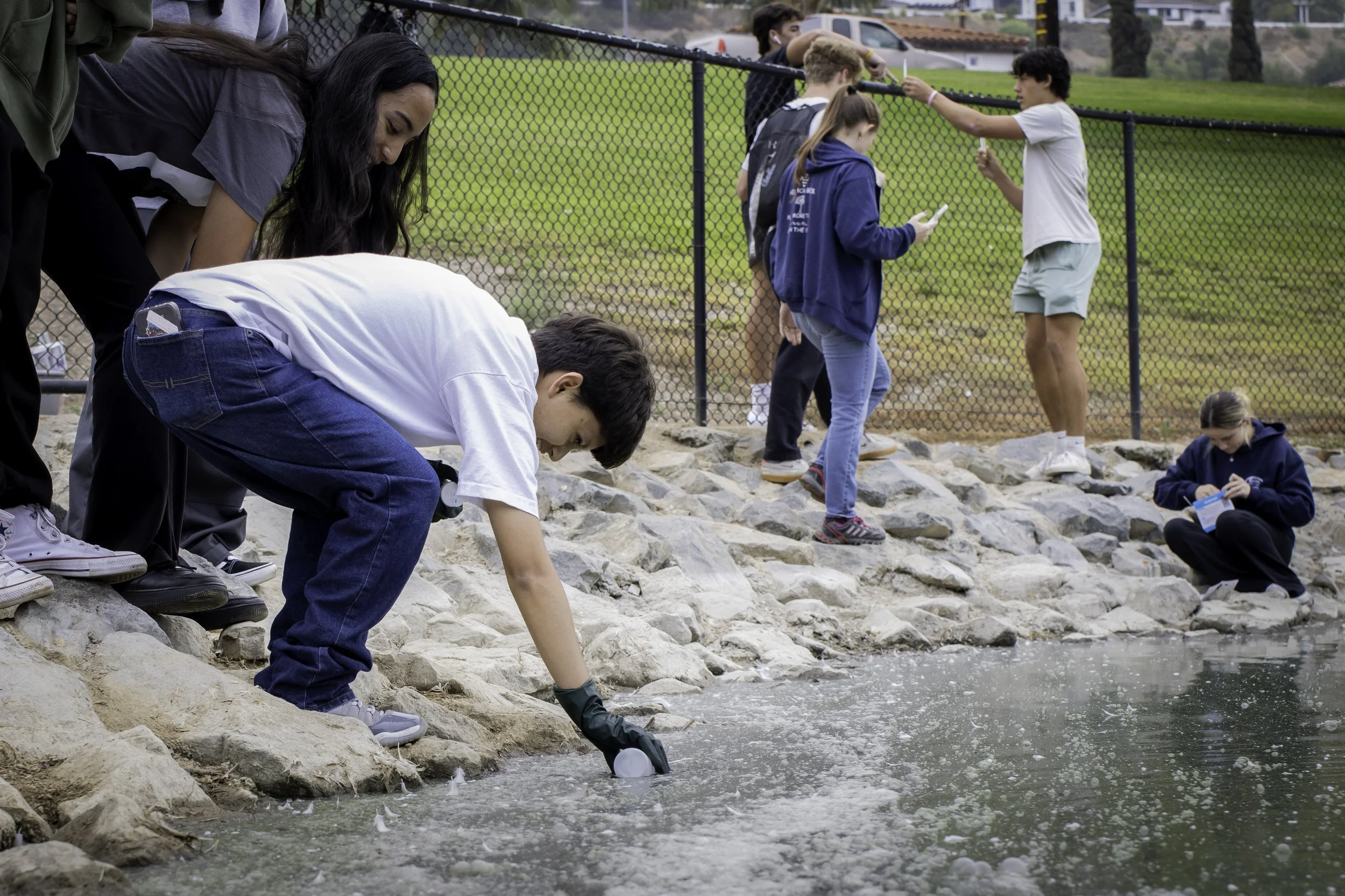 image of students collecting water samples