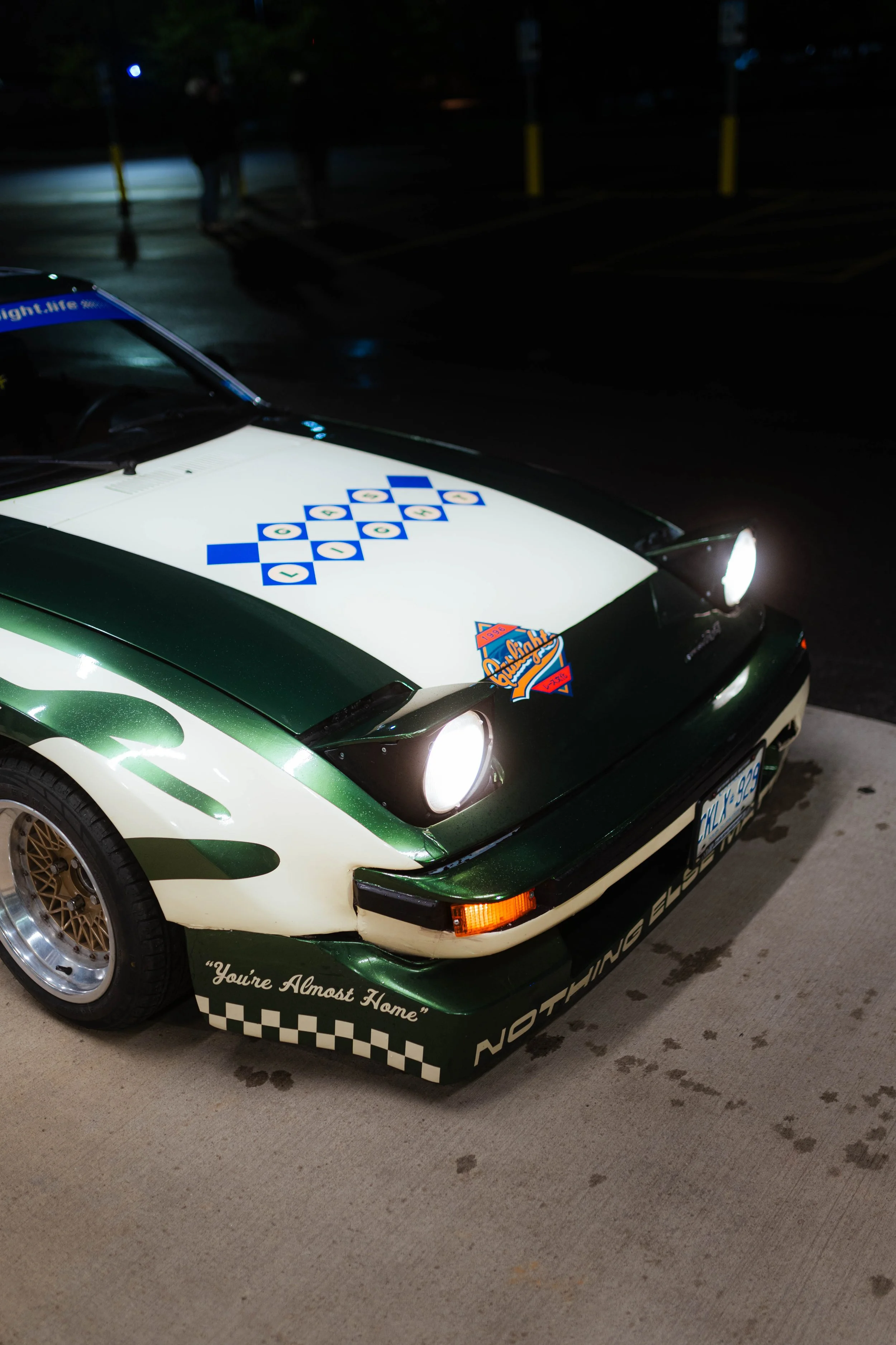 Green-and-white vintage car with custom racing livery from the Ultraviolet portfolio