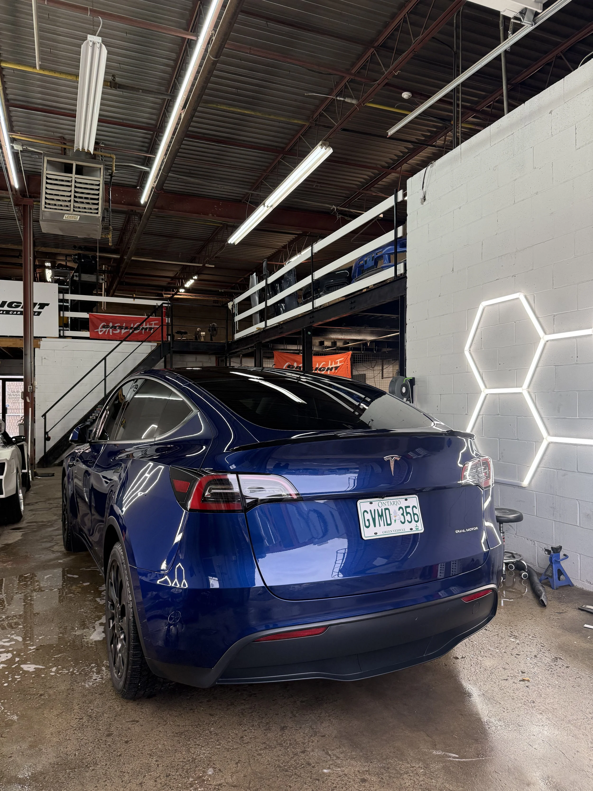 Blue Tesla Model 3 after detailing inside the studio