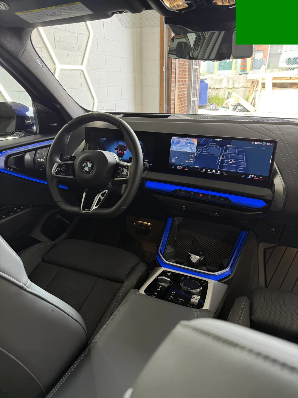 Detailed BMW interior with black leather seats and digital dashboard