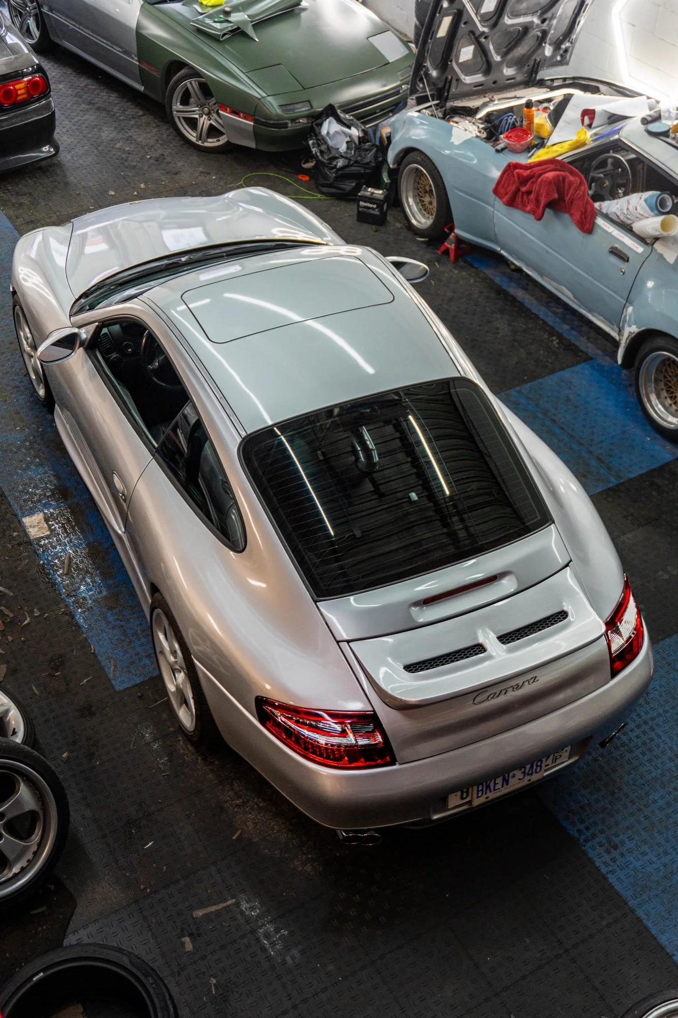 Silver Porsche 911 Carrera photographed inside the studio