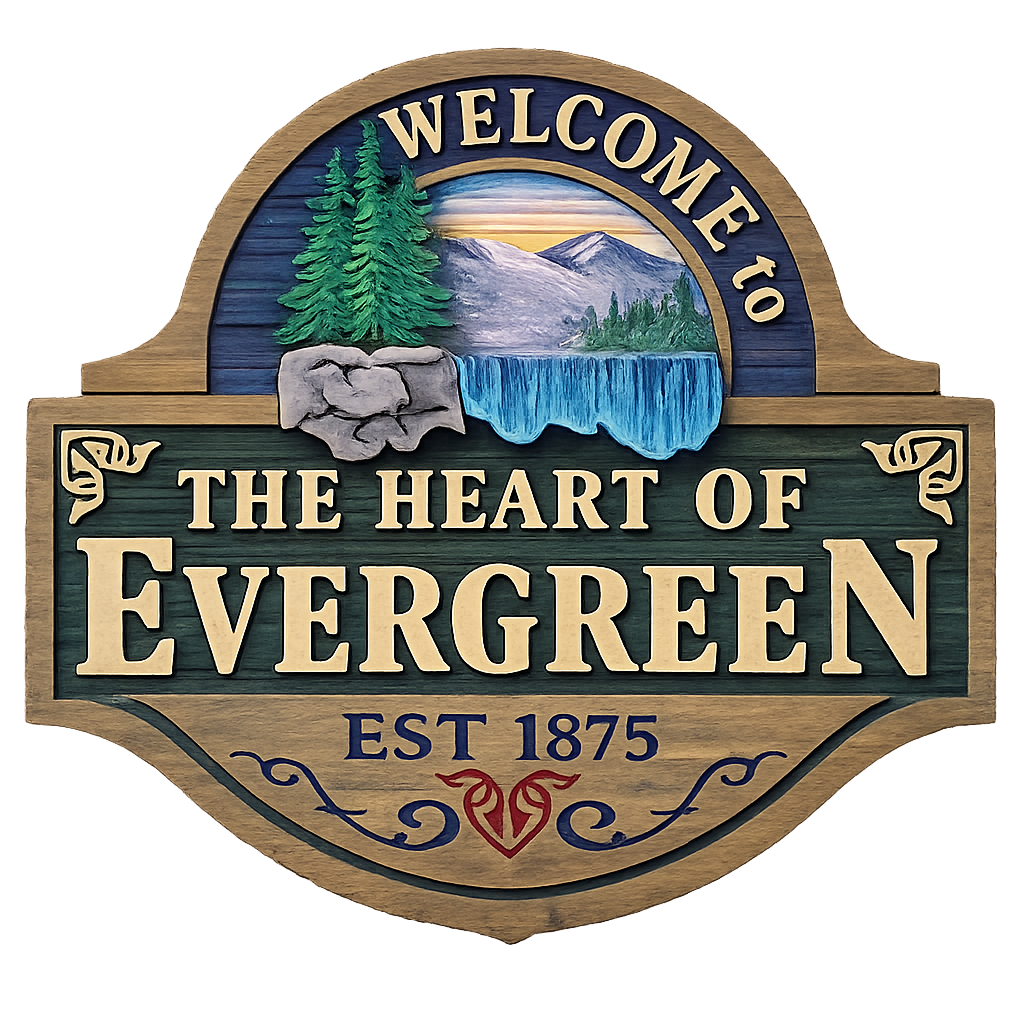 Wooden sign with mountain, pine trees, waterfall, and lake landscape. Text reads 'Welcome to the Heart of Evergreen, Est 1875'.