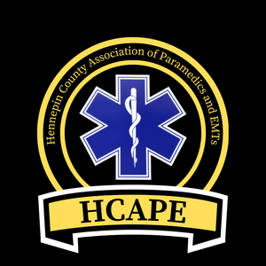 Logo of the Hempfield County Association of Paramedics and EMS, featuring a blue Star of Life with a caduceus, the organization's name encircling it, and the acronym HCAPe on a yellow banner.