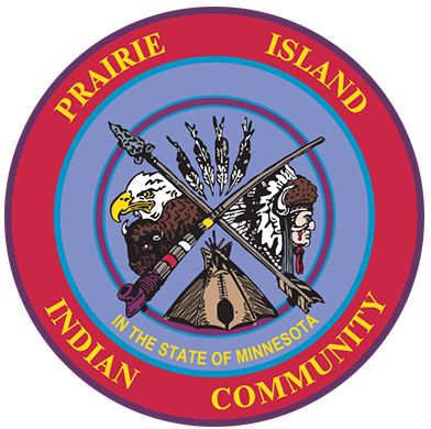 The Prairie Island Indian Community seal featuring a warrior's spear, bow, and a tipi with an eagle on white clouds, surrounded by the text 'Prairie Island Indian Community' and 'In the State of Minnesota'.