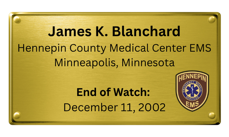 A gold-colored memorial plaque for James K. Blanchard, with text indicating his name, his affiliation with Hennepin County Medical Center EMS in Minneapolis, Minnesota, and marking the end of his watch on December 11, 2002. The plaque also features the Hennepin EMS emblem.