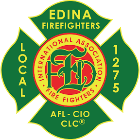 Badge for Edina Firefighters, part of the International Association of Fire Fighters, with green and yellow colors and a red central emblem