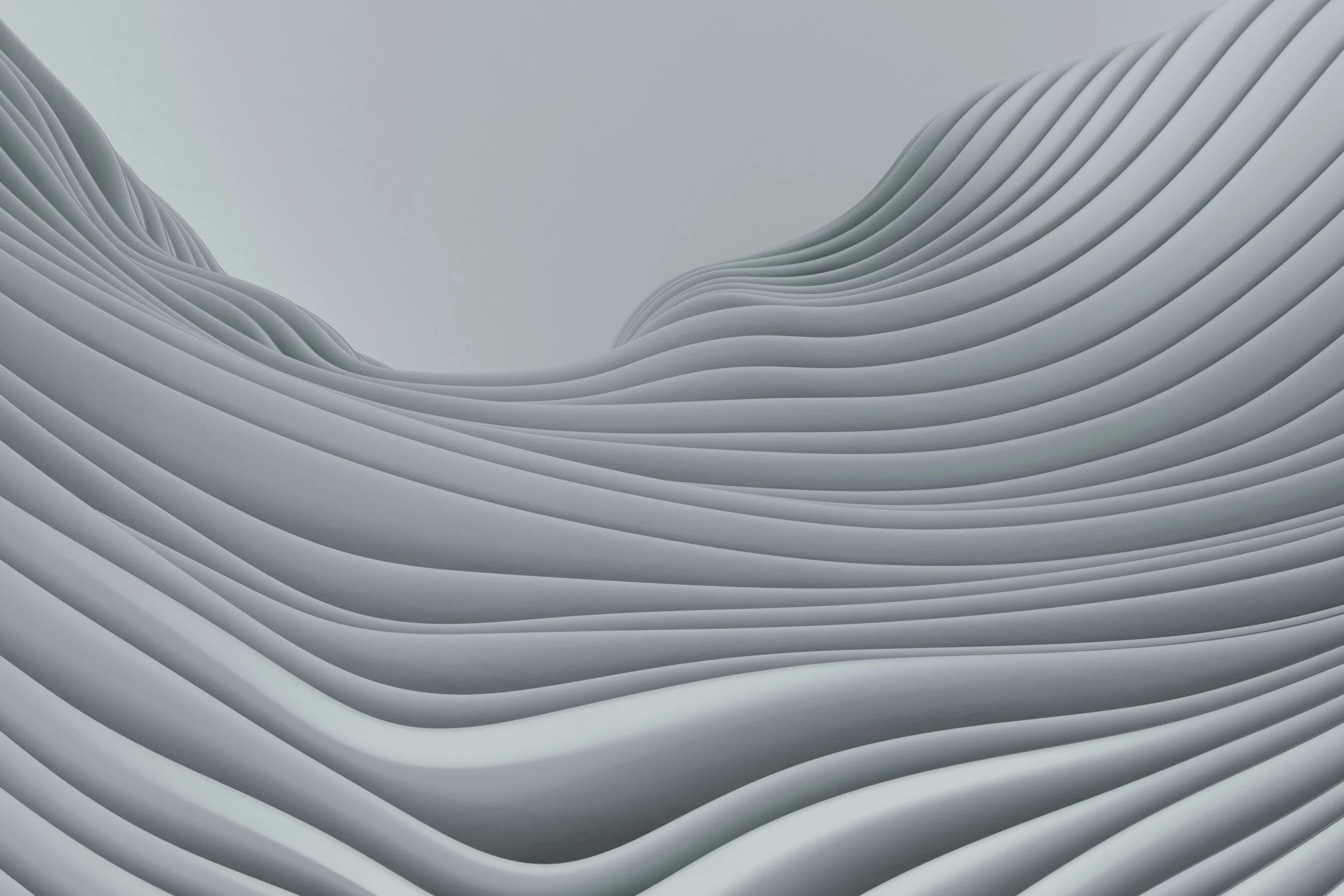 Close-up of layered, curved, white architectural design with smooth, flowing lines.