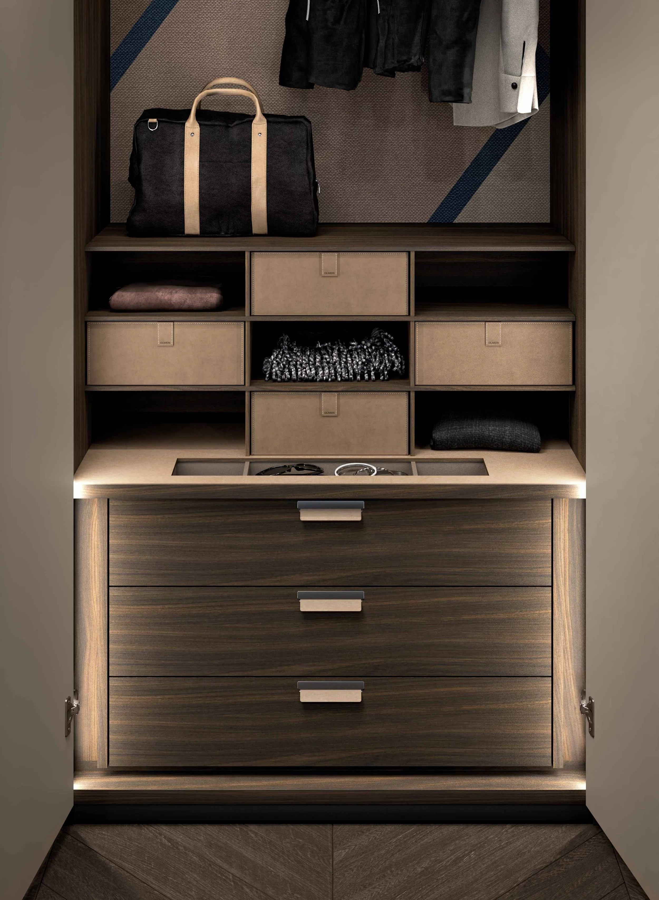 Inside view of an open wardrobe with dark wood finish, displaying various clothing items, a black and beige bag, and storage boxes, with a modern floor and ambient lighting.