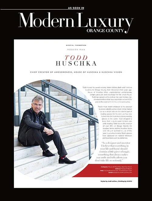 Magazine page featuring Todd Huschka, a luxury lifestyle subject, sitting on outdoor stairs, smiling, with text highlighting his achievements and background in design and invention.