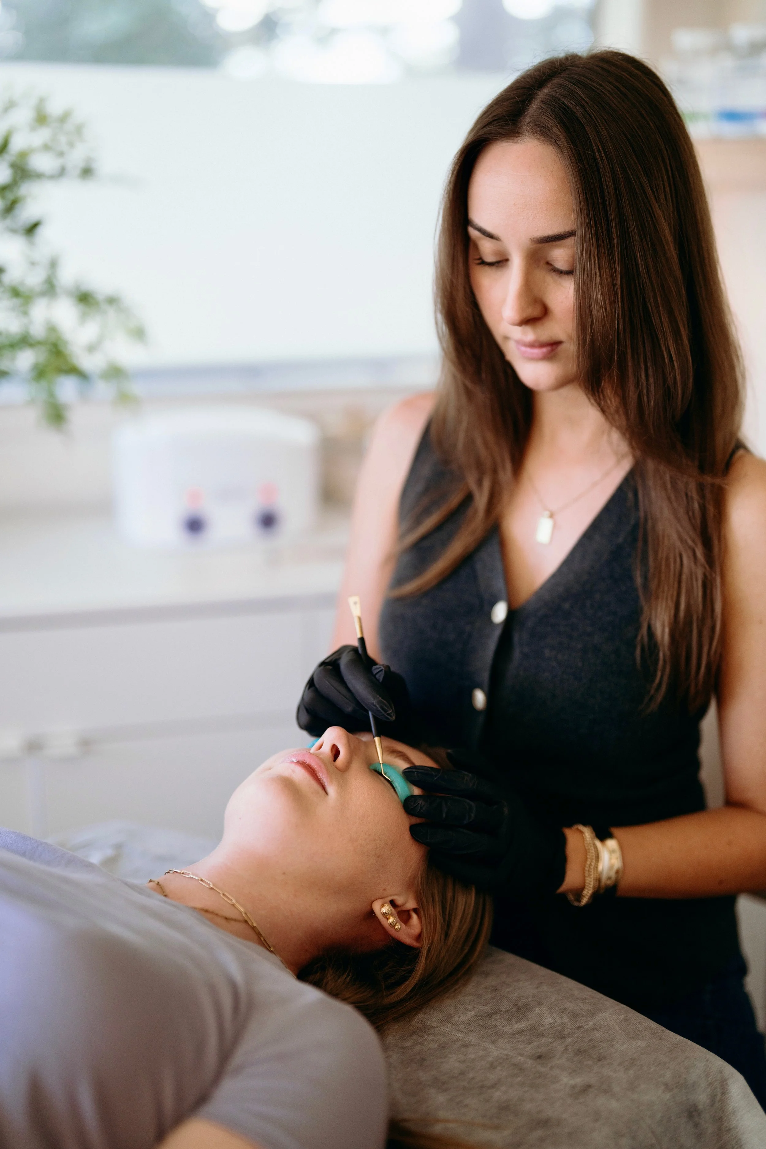 A woman receiving a flash lift in Vacaville with a licensed esthetician