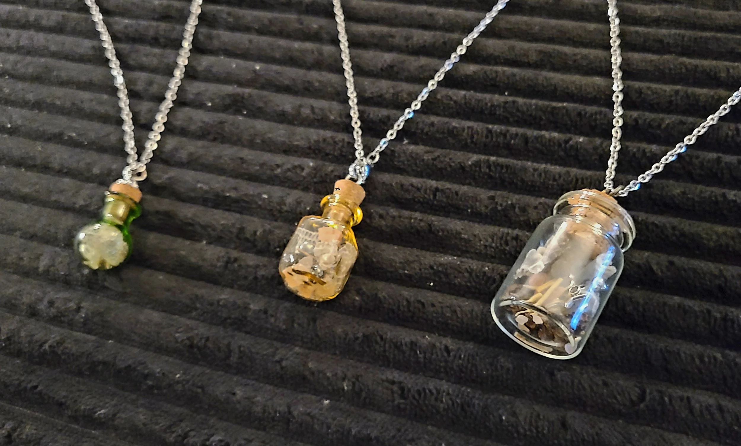 Up-close picture of three different Buzz Charms that will be featured in a Buzz Charms Special Edition Set.