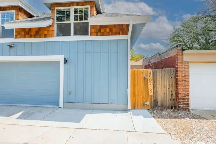 Exterior of The Sunnyside Carriage House, a detached blue carriage house in Denver's Sunnyside neighborhood