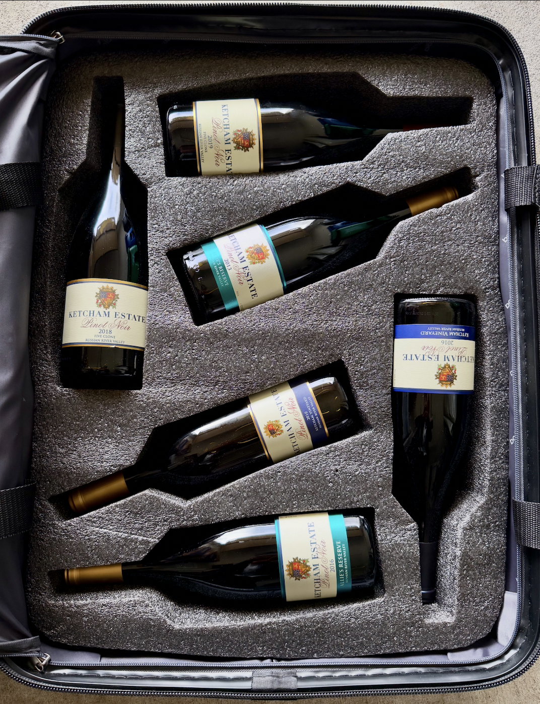 A wine suitcase filled with Ketcham Estate wines.