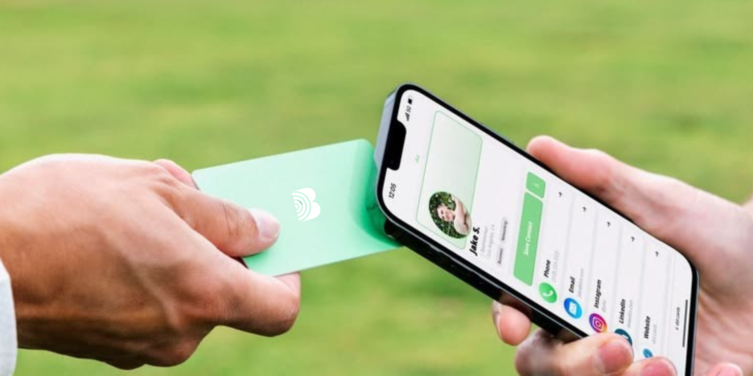 A person holding a smartphone displaying a digital business contact profile