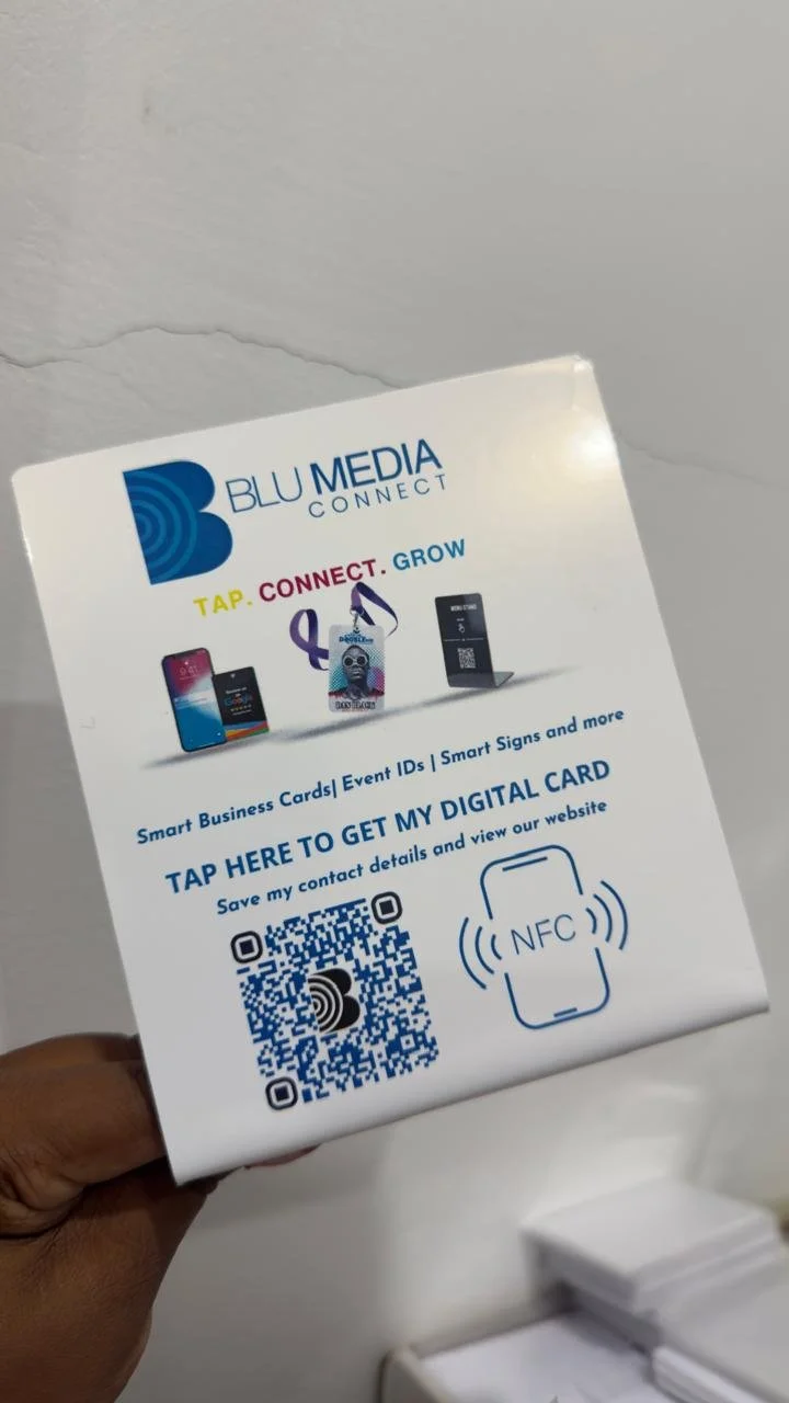 Smart sign for Blu Media Connect offering digital business cards, event IDs, and smart signs, with a QR code and NFC icon for digital contact sharing.