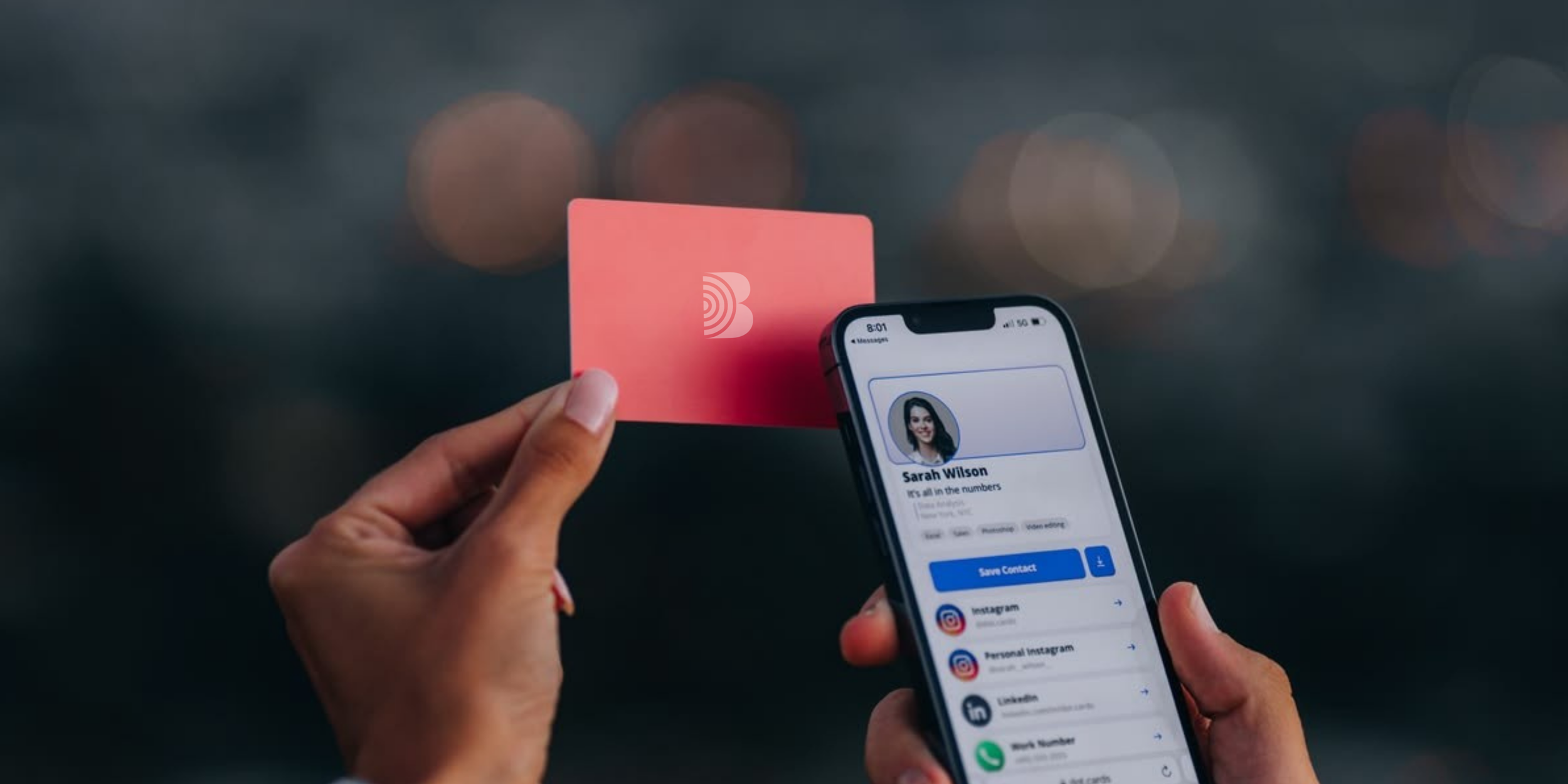 Person holding a smartphone displaying a contact named Sarah Wilson, with a pink contact card and a Facebook logo visible, and a pink nfc card with a logo in the background.