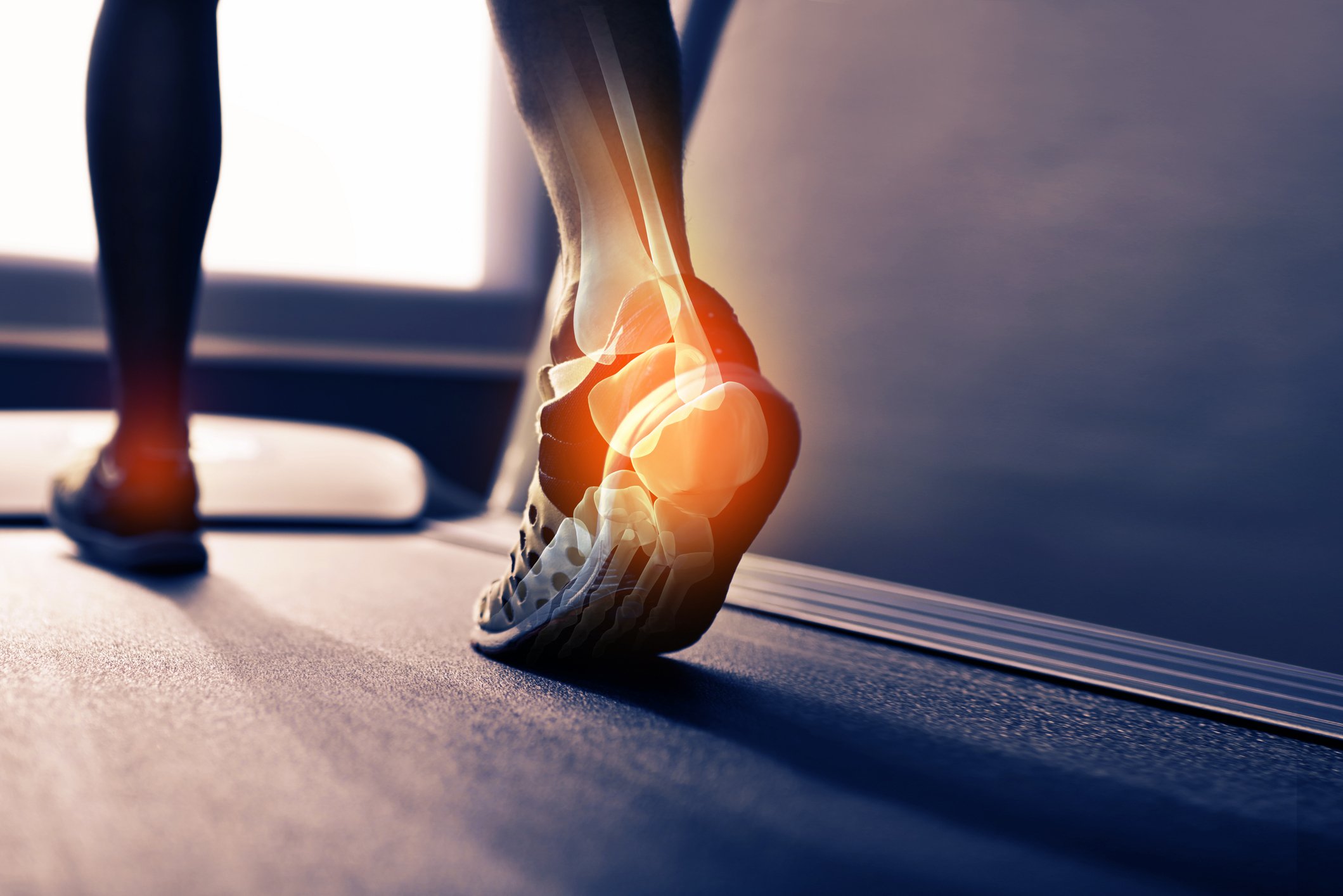 A person in athletic shoes with a digital overlay of an anatomical ankle and foot, suggesting focus on ankle or foot health and injury or medical imaging.