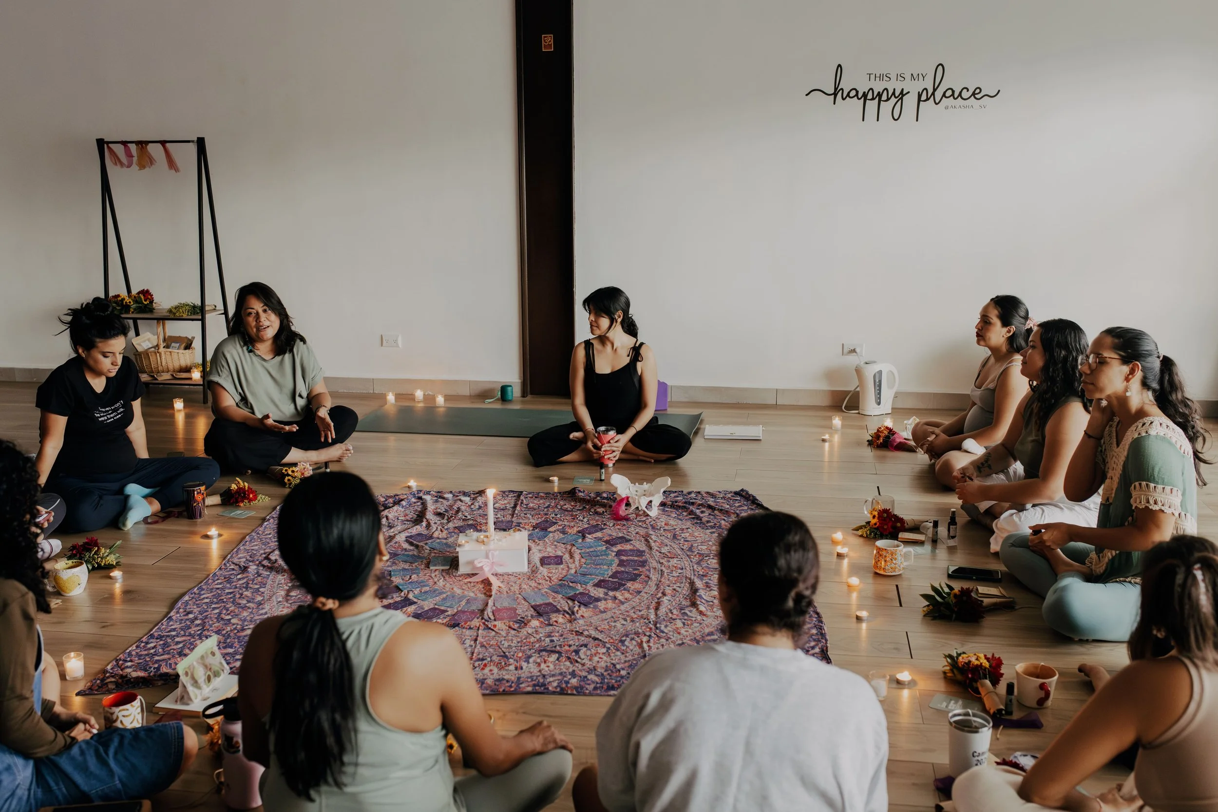 Birth doula Ale guiding a prenatal yoga class.
